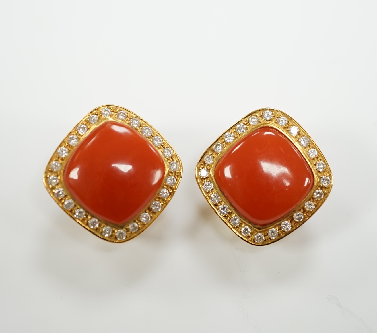 A pair of Italian 750 yellow metal, coral and diamond cluster set ear clips, 17mm, gross weight 15.6 grams.